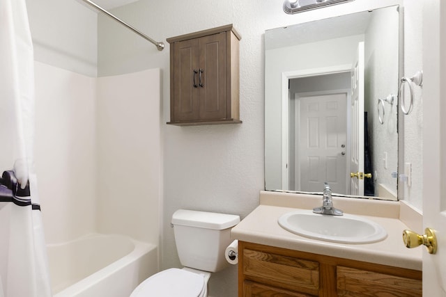 full bathroom featuring bathtub / shower combination, vanity, and toilet