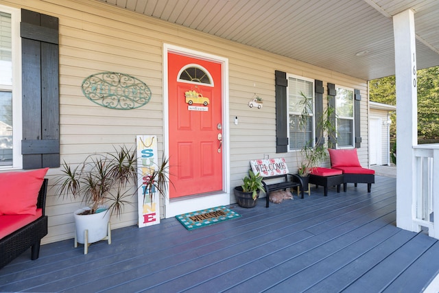 entrance to property featuring a porch