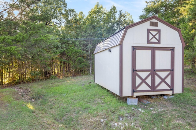 view of outdoor structure with a lawn