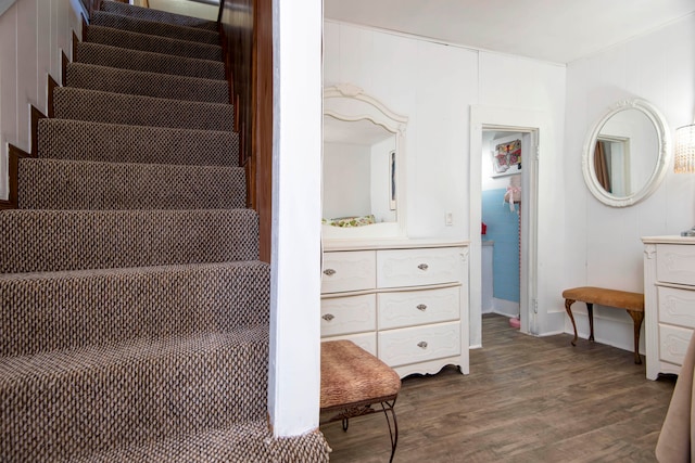 stairs featuring hardwood / wood-style floors