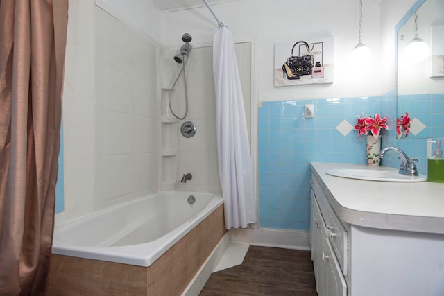 bathroom featuring vanity, tile walls, shower / bath combination with curtain, and wood-type flooring