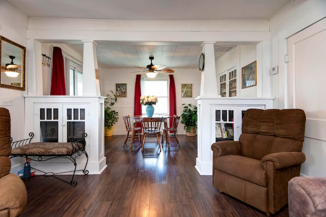 living area featuring ceiling fan and wood-type flooring