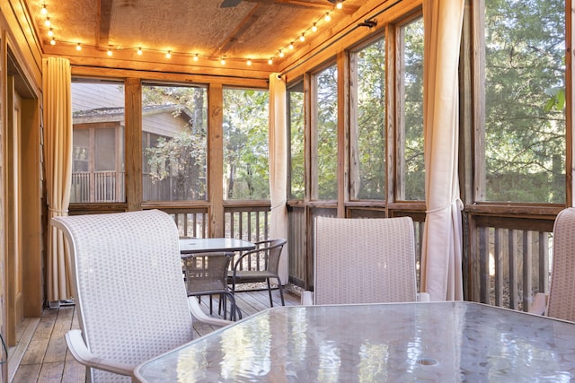 sunroom featuring wood ceiling