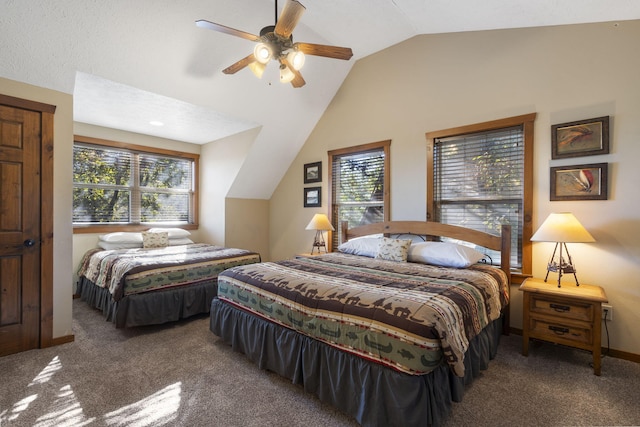 carpeted bedroom featuring lofted ceiling and ceiling fan