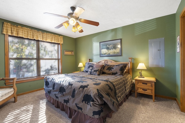 bedroom featuring electric panel, carpet, a textured ceiling, and ceiling fan