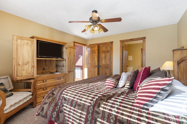 bedroom featuring ceiling fan, a closet, and carpet