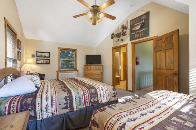 bedroom with a wall unit AC, connected bathroom, multiple windows, and ceiling fan