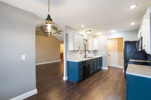 kitchen with sink, white cabinetry, blue cabinetry, black dishwasher, and dark hardwood / wood-style flooring