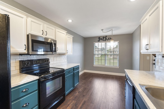 kitchen with blue cabinetry, dark wood-type flooring, white cabinetry, and black appliances