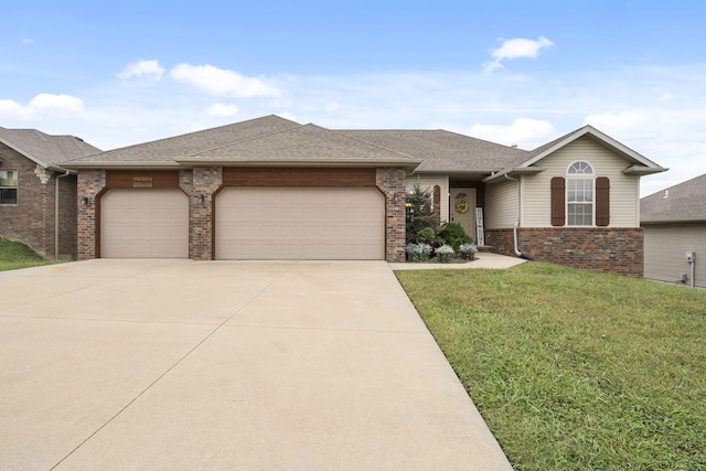 single story home featuring concrete driveway, a shingled roof, an attached garage, a front yard, and brick siding