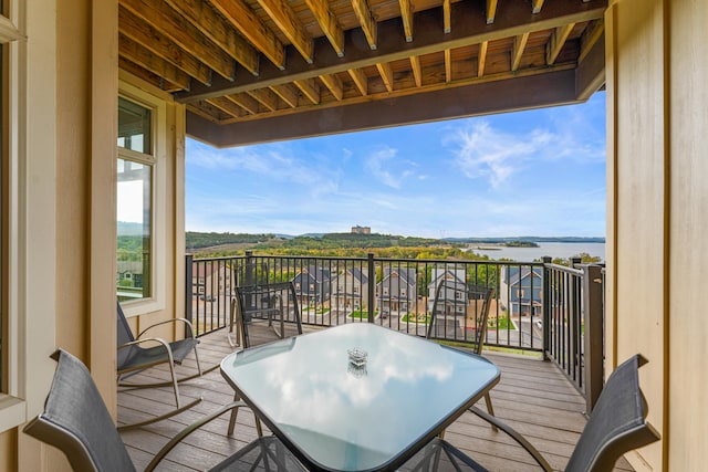 balcony featuring a water view