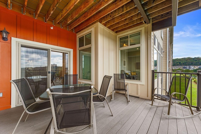 deck with outdoor dining area