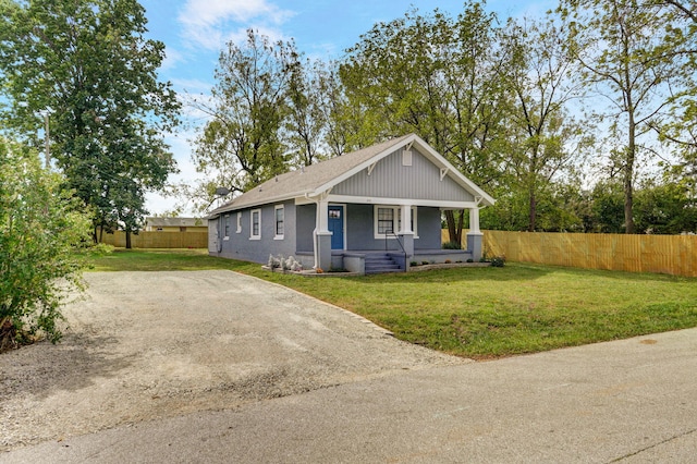 view of front of house with a front lawn and a porch