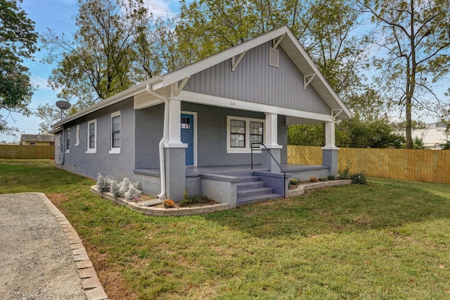 view of front of home with a front lawn and covered porch