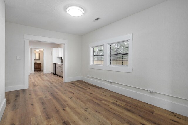 empty room with light hardwood / wood-style floors