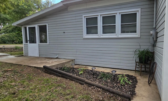 view of side of home with a patio area