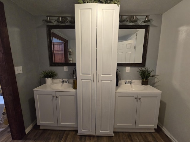 bathroom with vanity and hardwood / wood-style floors