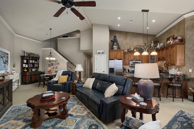 living room featuring ceiling fan with notable chandelier, light carpet, high vaulted ceiling, and ornamental molding