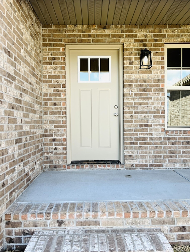 502 James, Billings, MO 65610 - property entrance with covered porch and brick siding