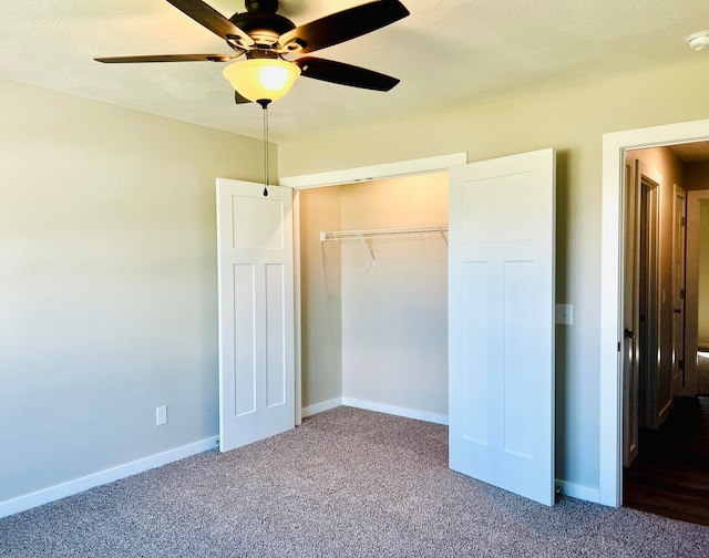 unfurnished bedroom with ceiling fan, a closet, carpet, and a textured ceiling