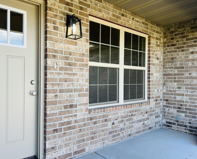 502 James, Billings, MO 65610 - property entrance with brick siding and a porch