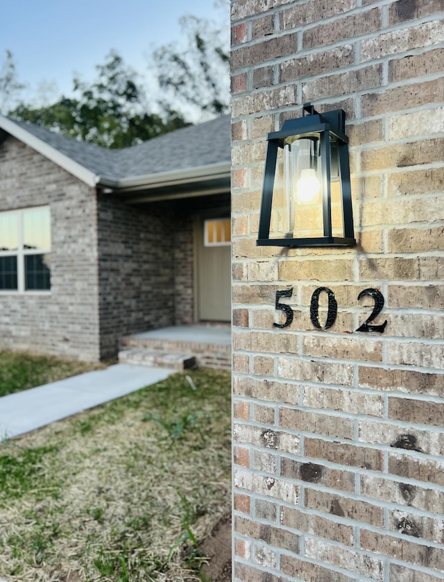 502 James, Billings, MO 65610 - exterior details featuring a shingled roof and brick siding