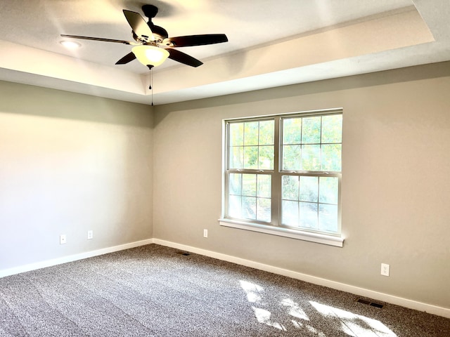 502 James, Billings, MO 65610 - spare room featuring a raised ceiling, visible vents, a ceiling fan, carpet floors, and baseboards