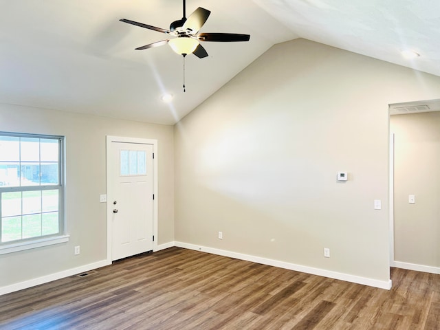 entrance foyer featuring wood-type flooring, vaulted ceiling, and ceiling fan