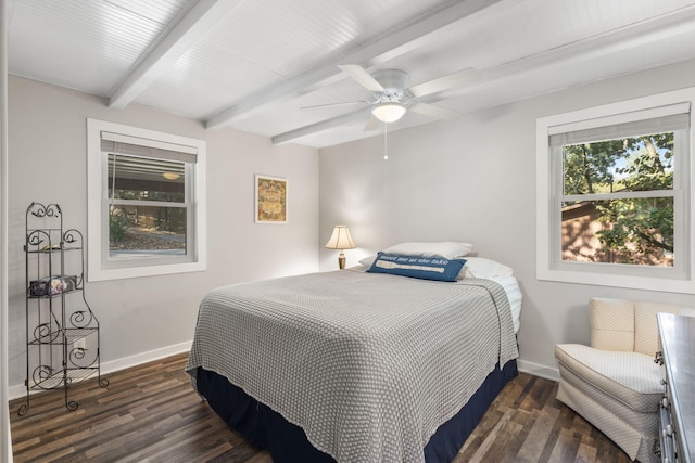 bedroom featuring baseboards, ceiling fan, beam ceiling, and wood finished floors