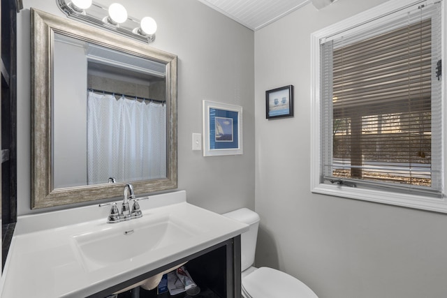 bathroom with vanity and toilet