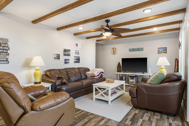 living area featuring a ceiling fan, beam ceiling, visible vents, and dark wood-style flooring