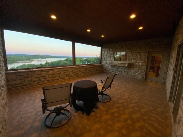 patio terrace at dusk with a water view