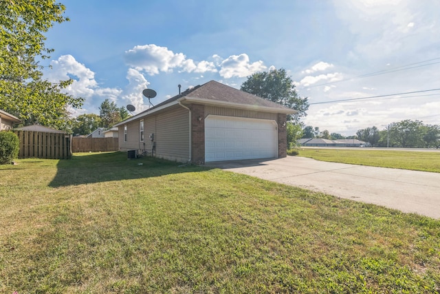 garage with cooling unit and a lawn