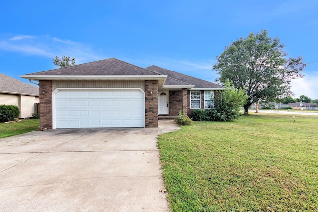 ranch-style house with a front yard and a garage