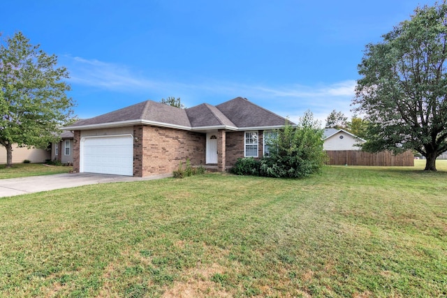 ranch-style house featuring a garage and a front yard