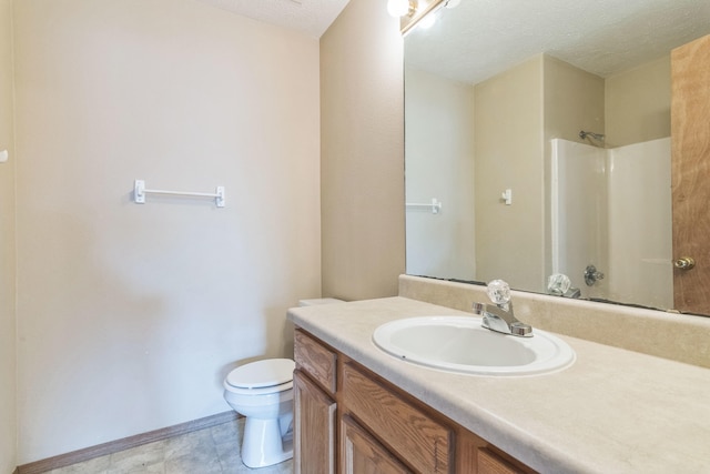 bathroom with walk in shower, vanity, toilet, and a textured ceiling