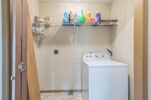 clothes washing area with washer / dryer