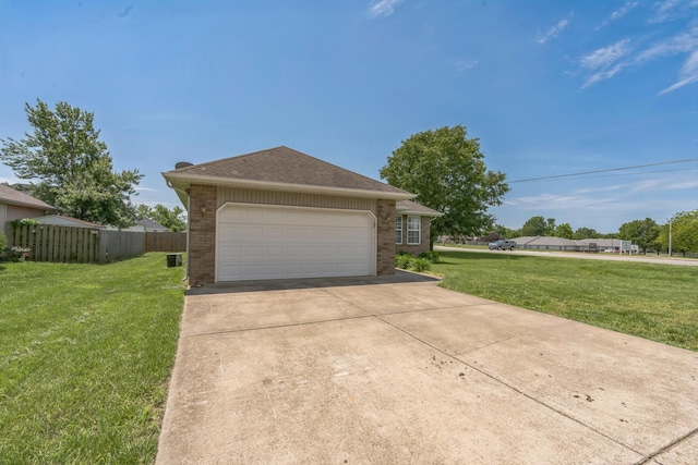 1006 Care Ave, Nixa, MO 65714 - garage featuring concrete driveway