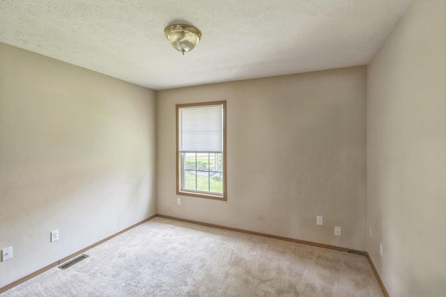 1006 Care Ave, Nixa, MO 65714 - spare room featuring carpet and baseboards