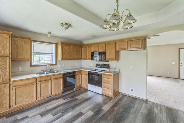 1006 Care Ave, Nixa, MO 65714 - kitchen featuring black appliances, a sink, arched walkways, a chandelier, and light countertops
