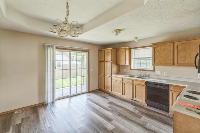 1006 Care Ave, Nixa, MO 65714 - kitchen featuring dishwasher, a sink, a chandelier, light countertops, and a textured ceiling