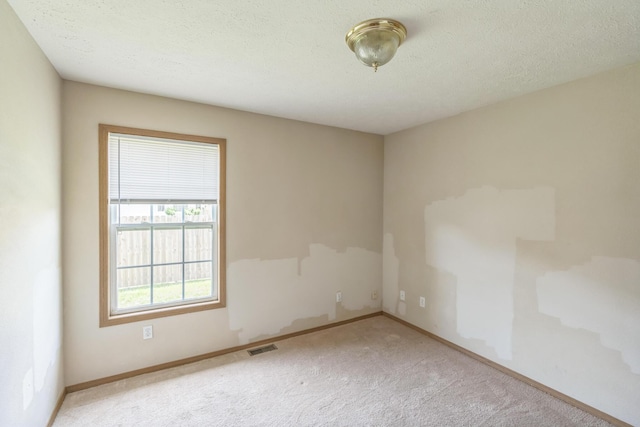 1006 Care Ave, Nixa, MO 65714 - carpeted spare room featuring baseboards and a textured ceiling
