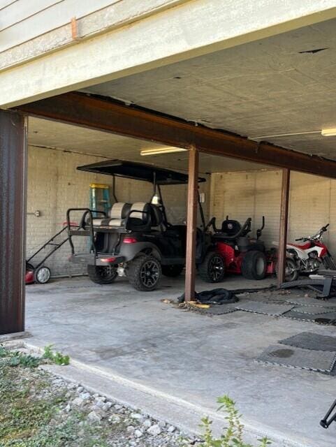 garage featuring a carport