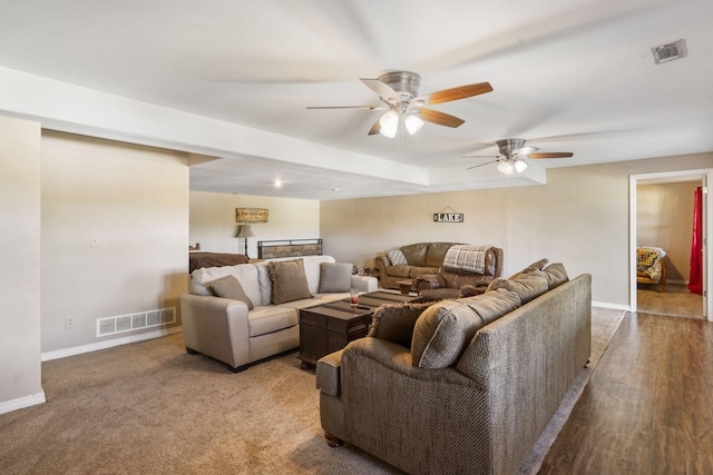 living room with ceiling fan and hardwood / wood-style floors