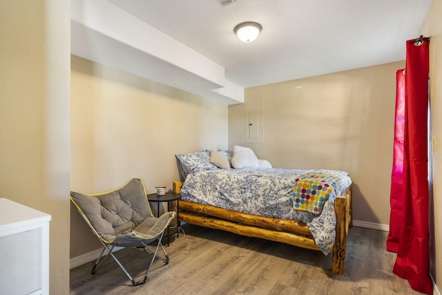 bedroom featuring hardwood / wood-style floors