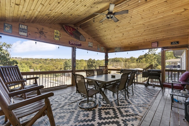 sunroom with wood ceiling, vaulted ceiling with beams, and ceiling fan