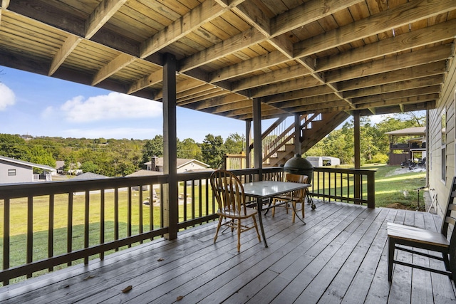 wooden deck with a yard