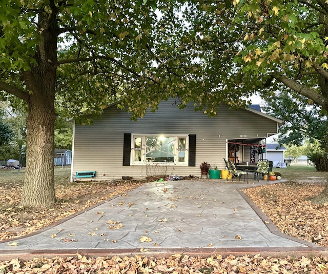 10603 N Main St, Butterfield, MO 65625 - rear view of house with a patio