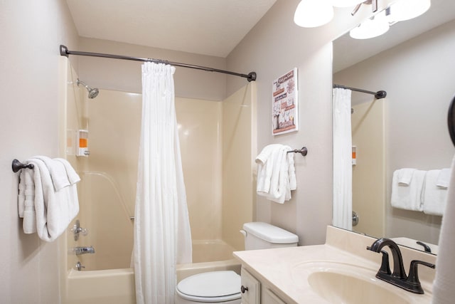 full bathroom featuring shower / bath combo with shower curtain, vanity, and toilet