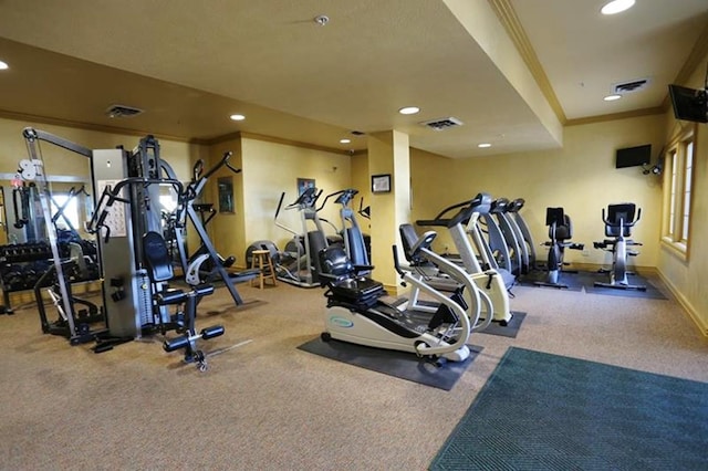 gym with carpet flooring and ornamental molding